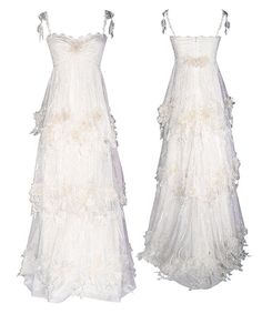 two white dresses on display against a white background