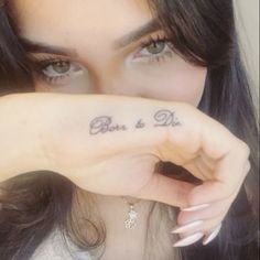 a woman holding her hand up to her face with the word boo and die written on it