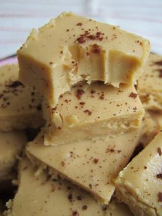 pieces of white chocolate sitting on top of a red plate