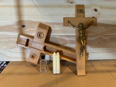 a wooden crucifix with a candle next to it