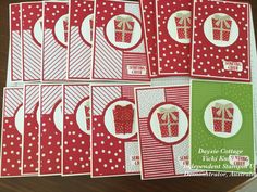 six christmas cards with red and green designs, one has a gift box on it