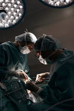 two surgeons performing surgery in an operating room