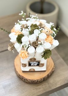 a bouquet of flowers sitting on top of a wooden table