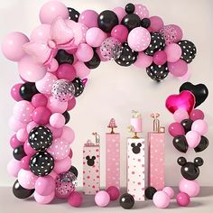 minnie mouse balloon arch with pink, black and white balloons