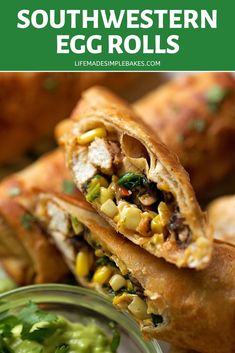 an egg roll is cut in half and served with guacamole, cilantro and corn