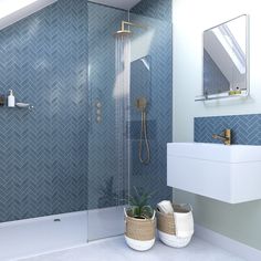 a bathroom with blue tiled walls and flooring, two planters on the side of the shower