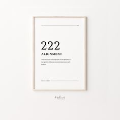 a white framed poster with the words 22 22 and an inscription that reads 22 22