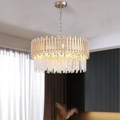 a chandelier hanging from the ceiling in a living room