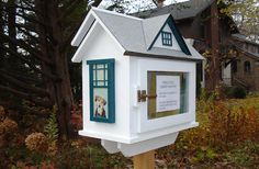 a white mailbox with a dog in the window