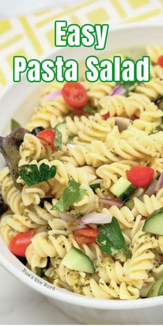 pasta salad in a white bowl on a yellow and white tablecloth with the words easy pasta salad above it