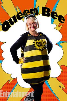 a woman in a bee costume standing with her hands on her hips