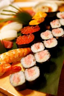 sushi platter with shrimp, shrimp, and other food items