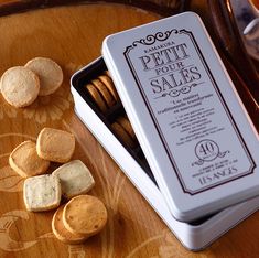 a box of wine corks sitting on top of a table next to some crackers