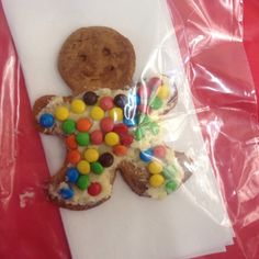 a cookie shaped like a butterfly with candy on it