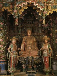 an ornately decorated shrine with two statues