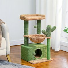 a cat tree in the middle of a living room