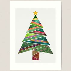 a watercolor christmas tree is shown in the shape of a star on white paper