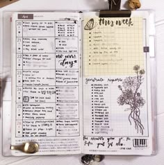 an open planner with flowers on it next to some scissors and other things in the pages