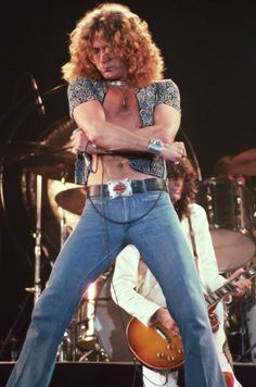 an image of a man on stage with his guitar