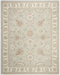 an area rug with various colors and designs on the carpet, including beiges, blues