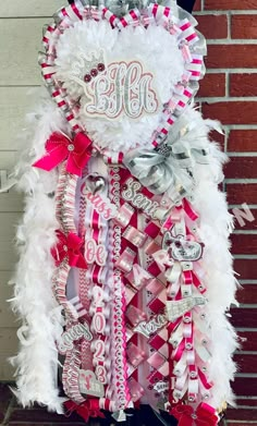 this is an image of a woman's pink and white feather boa with the word monogrammed on it