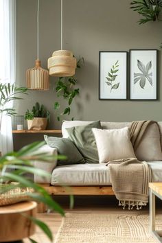 a living room filled with lots of plants next to a couch and coffee table on top of a hard wood floor