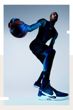 a man holding a basketball while standing in front of a white background with the words nike written on it