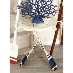 a white chair with blue decorations on it