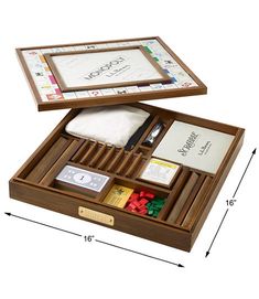 an open wooden box with various items in it on a white surface, and measurements for the contents