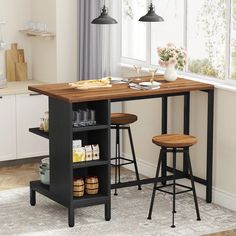 a kitchen table with two stools in front of it and an open shelf on the other side