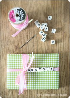 the craft kit is sitting on the table next to it's spools