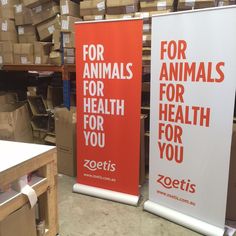 two red and white banners with the words for animals for health for you on them