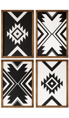 four black and white art pieces with geometric designs on the sides, one is framed in wood