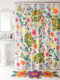 a shower curtain with colorful flowers on it