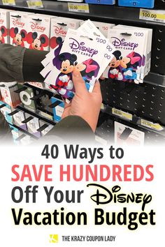 a person is holding up some disney vacation coupons in front of a store shelf