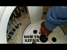 a man is working on the inside of a washing machine with words how to repair