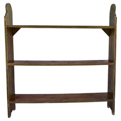 an old wooden shelf with two shelves on it