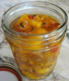 a jar filled with food sitting on top of a table