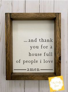 a wooden frame with the words and thank you for a house full of people i love amen