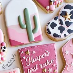 decorated cookies with pink, black and white designs