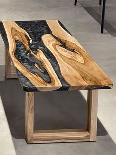 a wooden table sitting on top of a cement floor