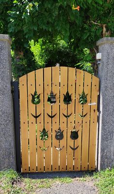 a wooden gate with plants growing through it