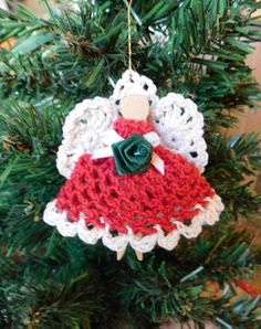 a crocheted ornament hanging from a christmas tree