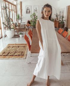 The Willow Dress Features - Sleeveless Smock Style - Drop Waist - Crew Neck - Full Length - Side Pockets Fabric 100% Linen Cold gentle machine wash. Do not tumble dry. Size Guide Small Size PhotographedS = AU 6-8US 2-4UK 4-6M = AU 10-12US 6-8UK 8-10L = AU 14-16US 10-12UK 12-14 Production Time As all items are made to order we require 5-7 business days for production Postage All packages are shipped with EXPRESS POST, and are delivered by DHL worldwide. Delivery is guaranteed within 1 week of shipment! Black Hooded Coat, Willow Dress, Simple Style Outfits, Sleeveless Long Dress, Latest Trend, Simple White, White Sleeveless, Linen Dresses, Drop Waist