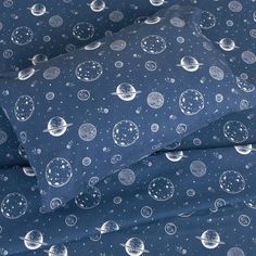 the blue and white space themed sheet set is made up of two sheets, one with planets on them