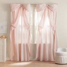 the curtains in this room are pink and white