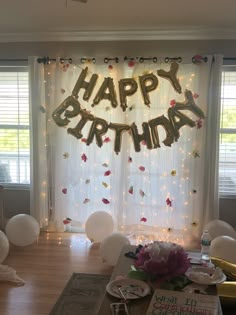 a birthday party with balloons and decorations