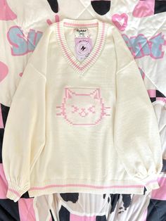 This sweater features a charming V-neck design adorned with delightful kitty patterns, making it irresistibly cute. The fabric is incredibly soft and cozy, ensuring a comfortable wear.  Please note that the price includes only the sweater.   	 		 			Size 			S 			M 			L 		 		 			Length 			62 			68 			72 		 		 			Bust 			120 			124 			128 		 		 			Sleeve Length 			49 			50 			51 Kawaii Sweater Dress, Cute Sweaters Aesthetic, Cozy Clothes Aesthetic, Kirby Sweater, Cute Core Clothes, Pokemon Sweater, Kawaii Things To Buy, Hello Kitty Clothing, Cute Kawaii Clothes