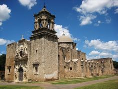 an old stone building with a clock tower