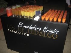 an assortment of orange juices are on display